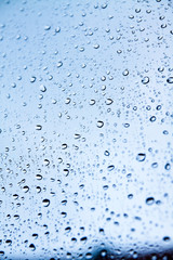 Raindrops on blue glass