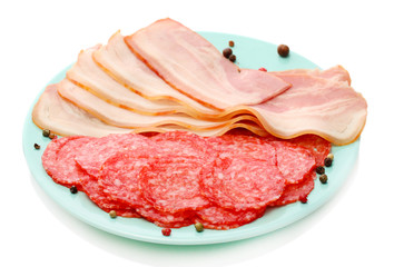 tasty bacon and sausage with spices on plate, isolated on white