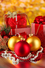 Christmas decoration and gift boxes on golden background