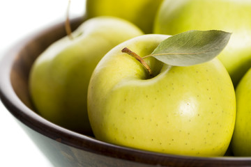 Close up of fresh apples in brown basket.