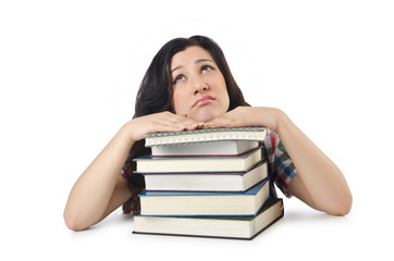 Tired student with textbooks on white