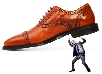 Woman domination concept with shoes and man