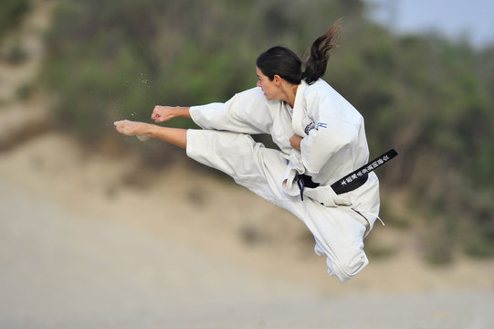 Karate fighter do the jump kick