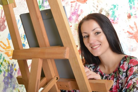 beautiful young woman painting