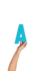 hand holding up the letter A from the bottom