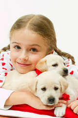 Best friends - little girl with cute puppies