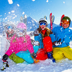 Ski, snow, sun and winter fun - happy family ski team