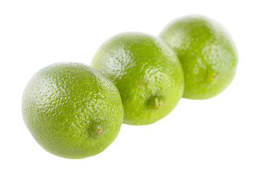 Three limes on the isolated white background