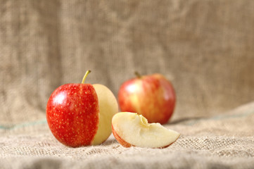Apple with slice on a textile background