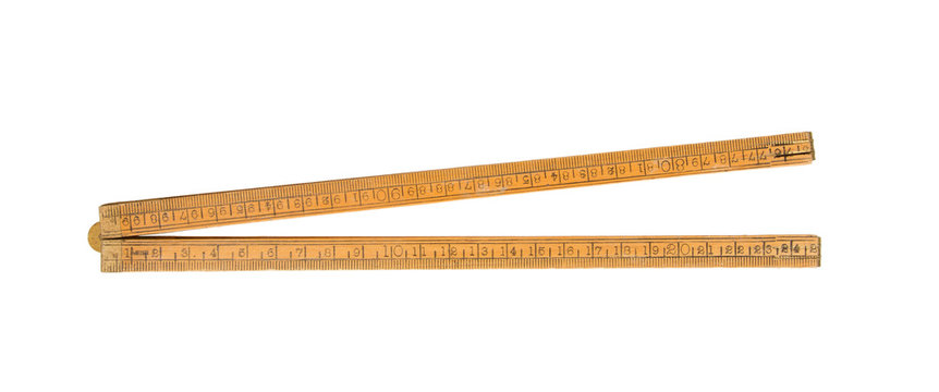 Very old ruler isolated on a white background