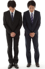 two young businessmen with a bow