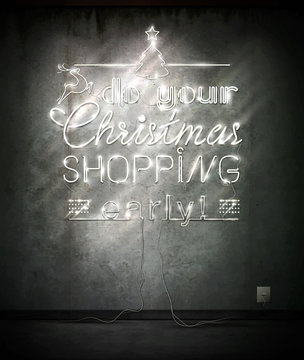 Do Your Christmas Shopping Early, Neon Sign Over Old Wall.