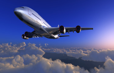 Fototapeta na wymiar Pasażerski samolot na niebie chmury.