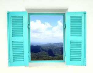 Greek style window with mountain and sky view