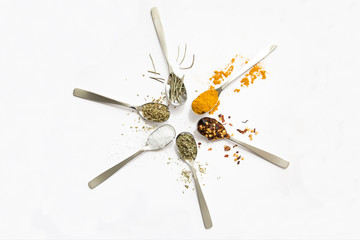 Spices and herbs on white background
