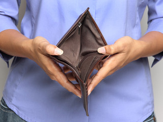 Person holding an empty wallet - showing bankruptcy