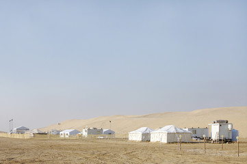 Beautiful landscape of sand dunes and camping huts