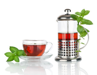 Teacup and teapot with mint, isolated on white