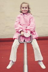 Little girl on a seesaw