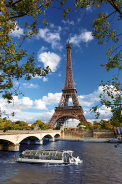 Eiffel Tower  with boat on Siene in  Paris, France