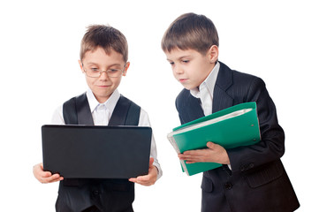Two young boys looking laptop screen