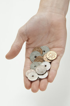 Hand holding danish currency