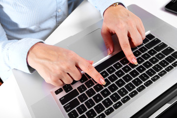 Hands with a computer keyboard.