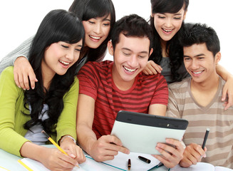 Friendly group of students with tablet pc