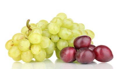 ripe sweet grapes and plums isolated on white