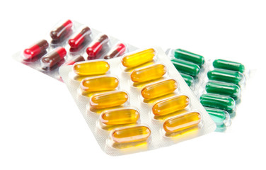 Capsules packed in blisters, isolated on white