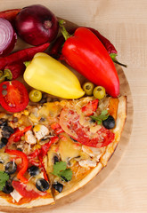 Delicious pizza with ingredients close-up