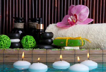 Beautiful spa setting near pool on bamboo background