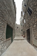Fototapeta na wymiar Narrow old street in stone, Croatia