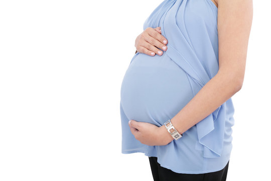 Image of pregnant woman touching her belly with hands isolated o