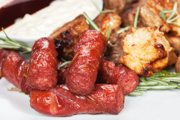 Grilled sausage with sauce and vegetables