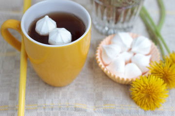 Fototapeta na wymiar tea in glass cup and flowers