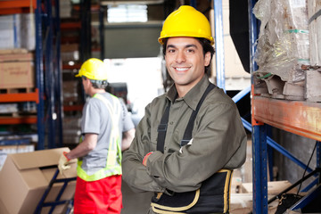 Young Foreman With Arms Crossed At Warehouse