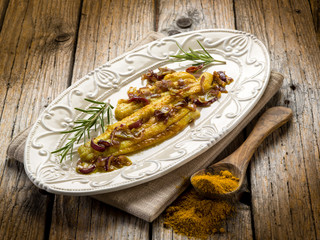 sole fish with curry and onions