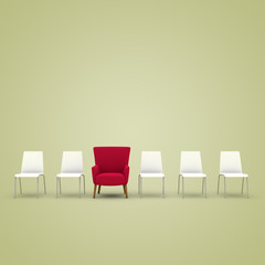 Roter Sessel zwischen den Stühlen
