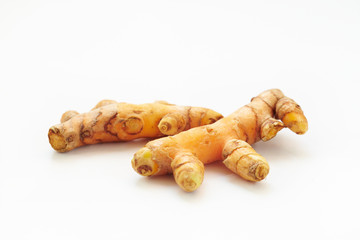 Turmeric root on white background