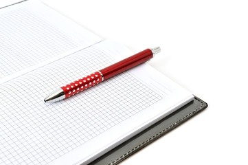 Notebook and pen isolated on white