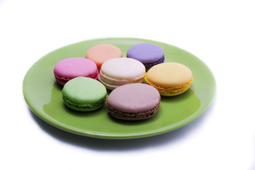 colored sweets on green plate