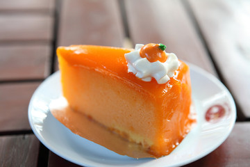 Orange cake on wood background