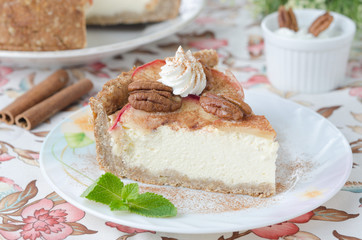 slice of cheesecake with apples and caramelized pecans