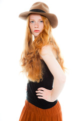 Fashion girl with long red hair and hat against white background