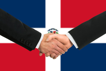 The Dominican Republic flag and business handshake.