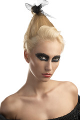 blonde girl with dark make-up turned of three quarters