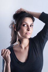 Obraz premium woman applying foundation powder or blush with makeup brush