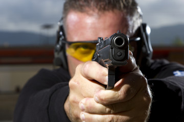 Man shooting  on an outdoor shooting range