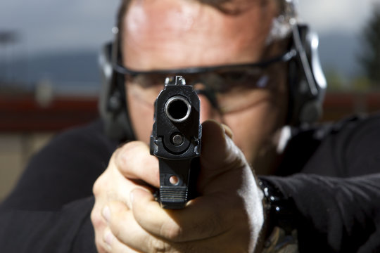 Man shooting  on an outdoor shooting range